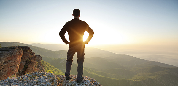 Man on top of mountain